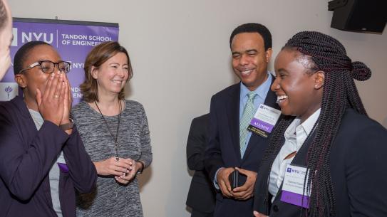 Alumni and Dean Kovačević share a laugh