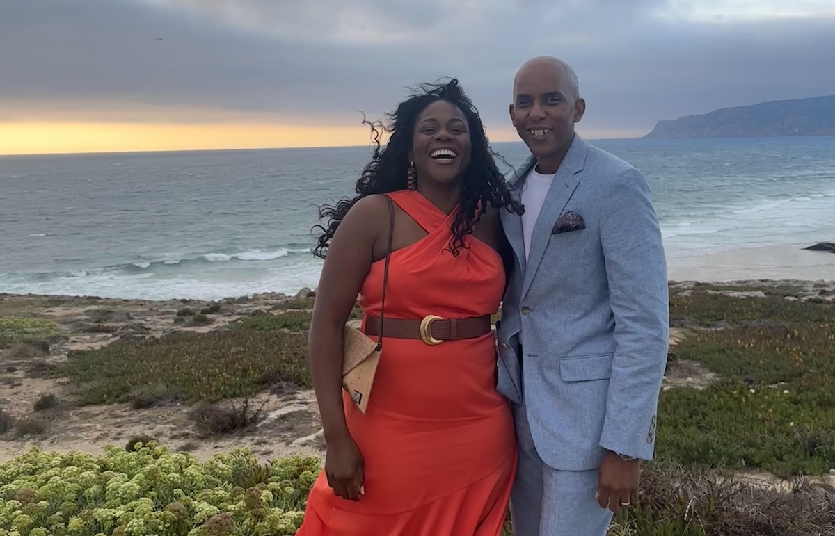 Smiling couple by the coast