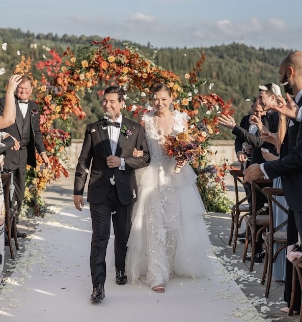 Couple Joe and Courtney walking down the aisle at their wedding